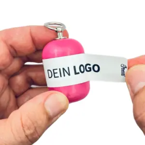 Erste-Hilfe Set als Streuartikel – ideal als Giveaway & personalisiertes Kundengeschenk – mit Logo bedrucken lassen mit rosa Kapsel beim öffnen