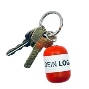 Erste-Hilfe Set als Streuartikel – ideal als Giveaway & personalisiertes Kundengeschenk – mit Logo bedrucken lassen mit rot Kapsel als Schlüsselanhänger