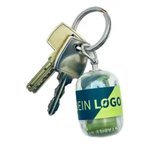Erste-Hilfe Set als Streuartikel – ideal als Giveaway & personalisiertes Kundengeschenk – mit Logo bedrucken lassen mit transparent Kapsel als Schlüsselanhänger