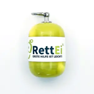 Notfall-Set-fuer-unterwegs-als-RettEi-Original-via-Erste-Hilfe-Schluesselanhaenger-mit-Beatmungstuch-zur-Mund-zu-Mund-Beatmung-mit-gelb-Kapsel-in-Seitenansicht
