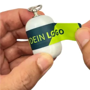 Erste-Hilfe-Set-als-Streuartikel-–-ideal-als-Giveaway-personalisiertes-Kundengeschenk-Notfallset-mit-Logo-bedrucken-lassen-mit-weißer-Kapsel-beim öffnen